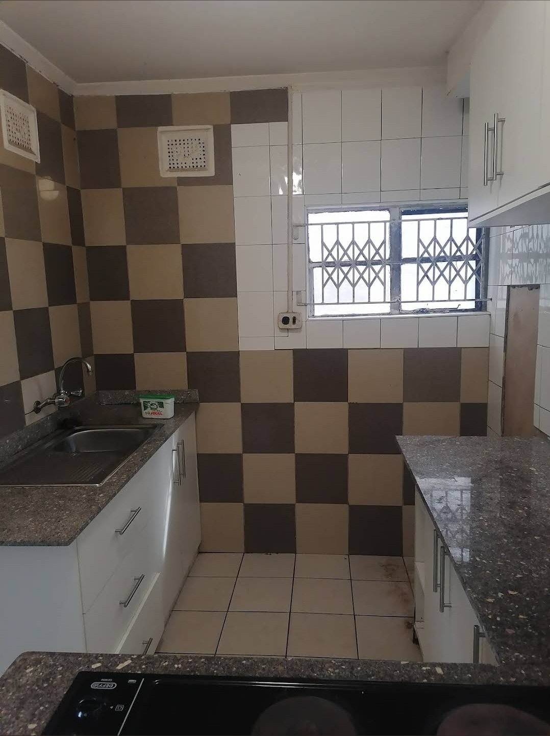 Checkered tile kitchen with sink